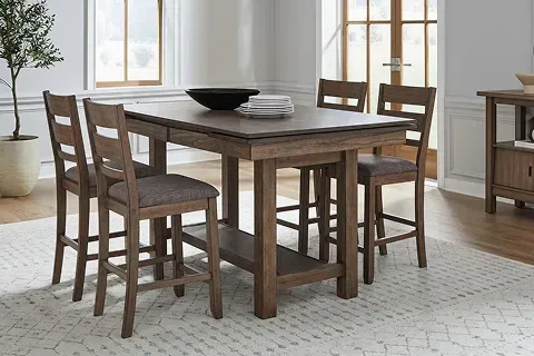 Liberty Furniture dining room set featuring a large wooden table and four matching upholstered chairs in a home setting.